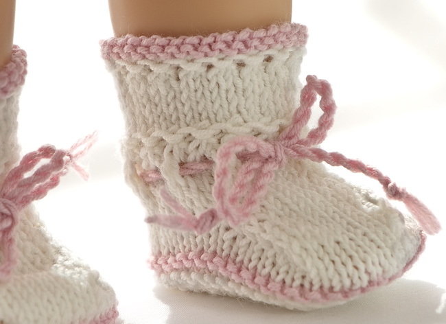 Step out in style with Florence's shoes, knitted in white with lovely pink borders to complement her outfit