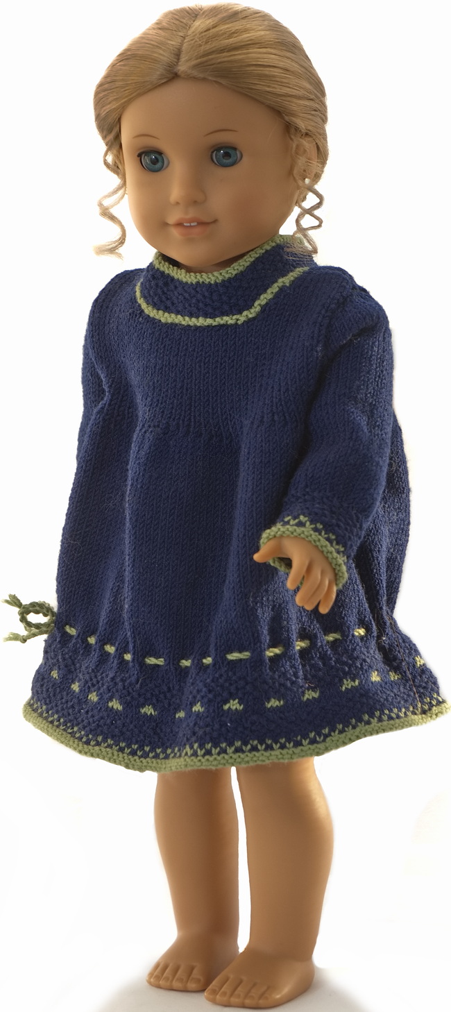 This vibrant blue and green dress is perfect for your American Girl doll. The detailed moss stitch and charming eyelets add a unique touch to this delightful outfit.