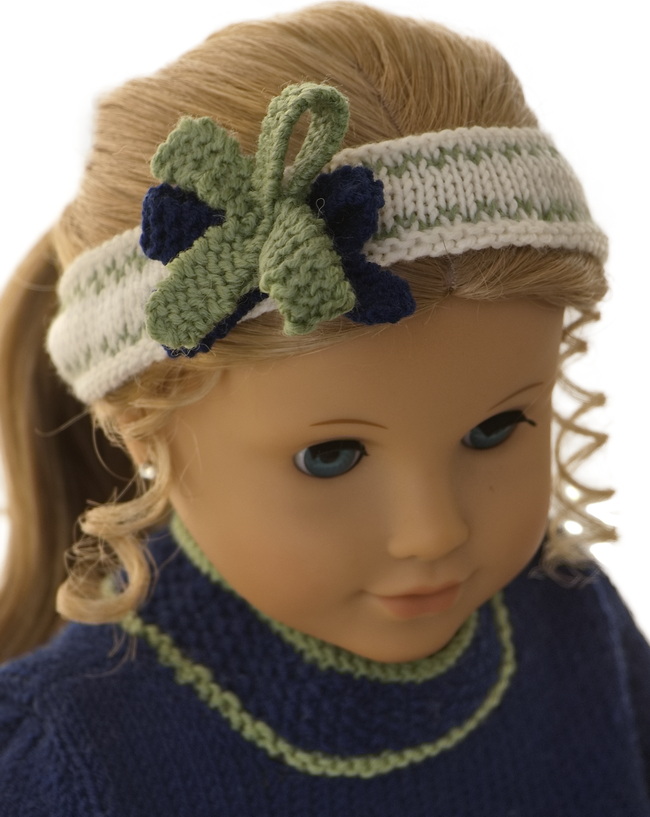 Adorn your American Girl doll’s hair with this beautiful white and green hairband. The elegant design and charming bows make it a standout accessory.