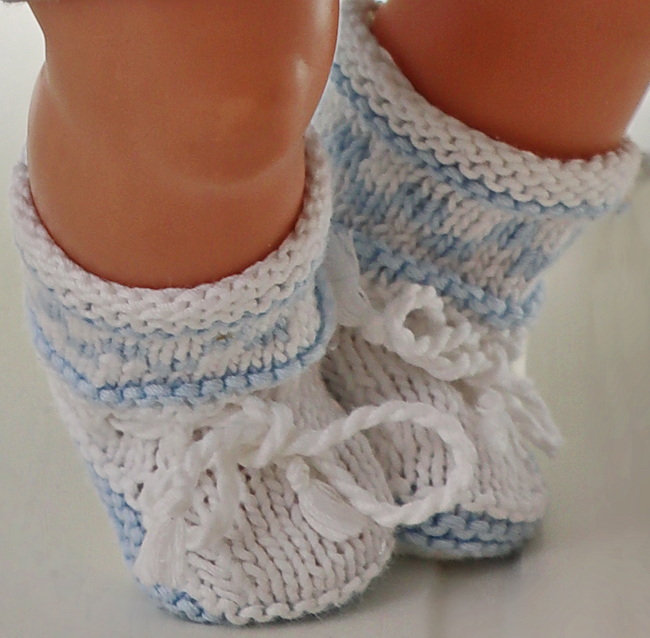 As we continue our journey through Aryan’s charming doll wardrobe, let’s focus on the finishing touch—the adorable blue pattern socks. These miniature wonders will keep Aryan’s tiny feet cozy and stylish. Grab your needles, and let’s knit these delightful socks!